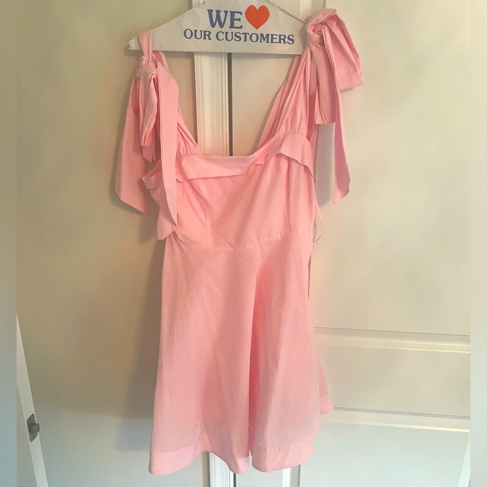 Shoulder tied, baby doll dress. Never worn.